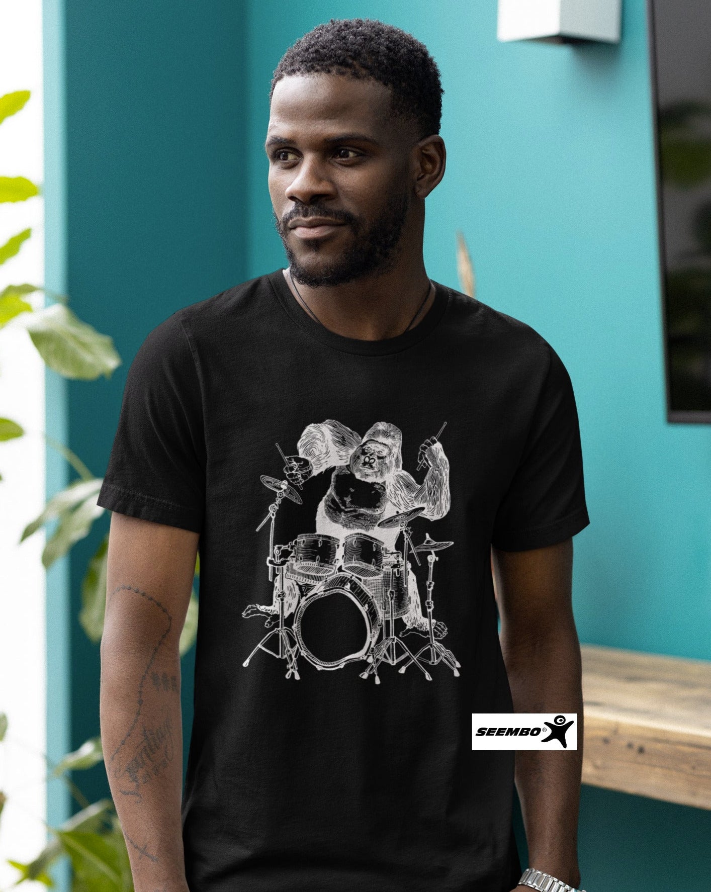 seembo-gorilla-playing-drums-drummer-a-man-with-black-t-shirt