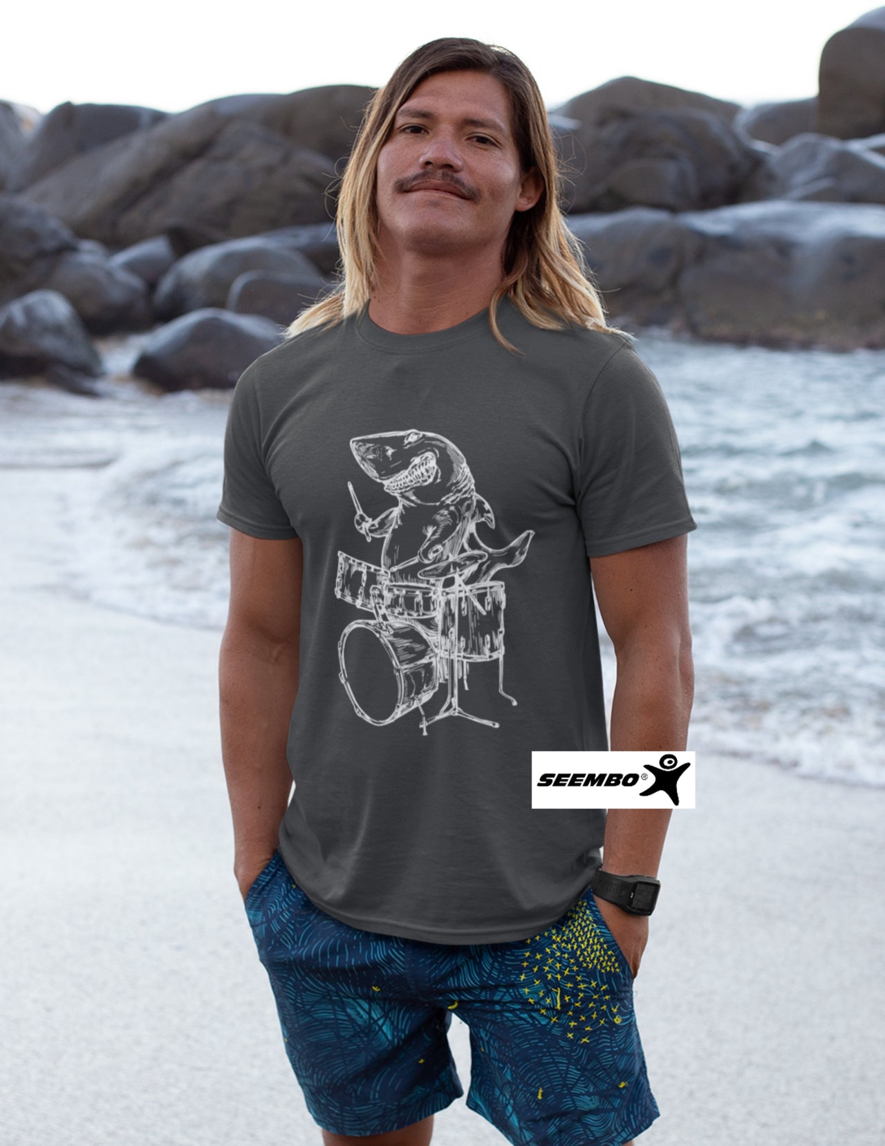 seembo-shark-drummer-playing-drums-musician-music-band-a-men-standing-on-the-beach-asphalt-color-t-shirt